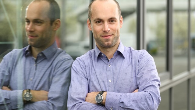 Associate leaning against window