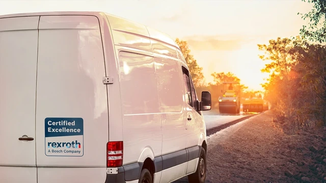 White van with Certified Excellence logo on a road construction site